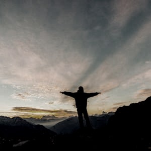 a person on top of the mountain