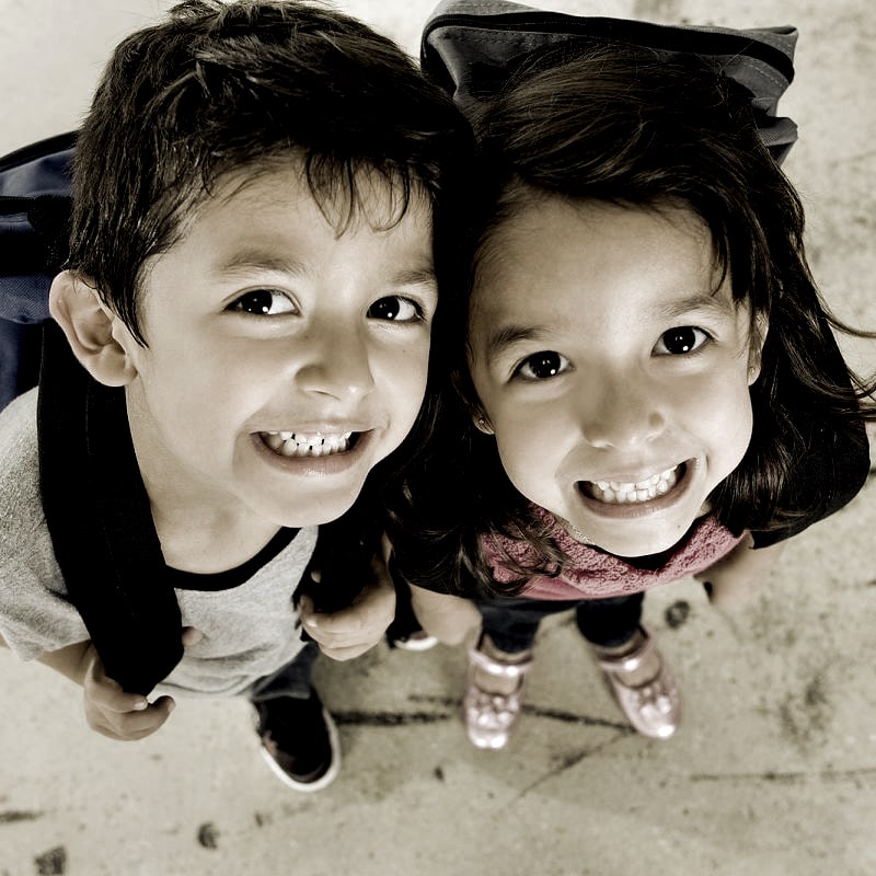 Little Boy And Girl With Their Backpacks Min